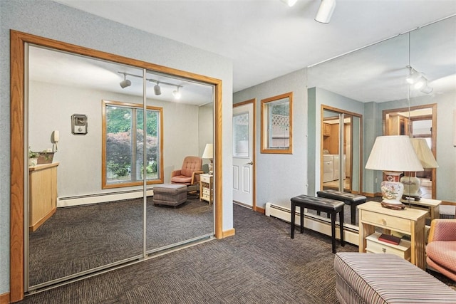 4 Wilbur Rd, Lincoln, RI 02865 - sitting room featuring a baseboard radiator, carpet flooring, track lighting, and washing machine and dryer