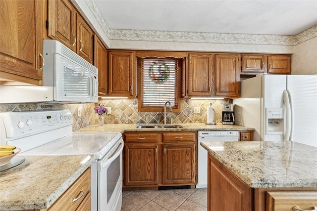 4 Wilbur Rd, Lincoln, RI 02865 - kitchen featuring white appliances, brown cabinets, and light tile patterned floors