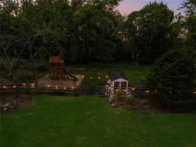 40 Charlotte Ave, North Kingstown, RI 02874 - yard at dusk featuring a playground