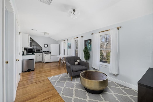 40 Charlotte Ave, North Kingstown, RI 02874 - living area featuring light wood-style floors and vaulted ceiling