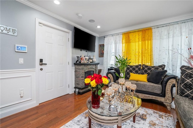 43 Amsterdam St, Providence, RI 02909 - living area with ornamental molding, wood finished floors, a wainscoted wall, recessed lighting, and a fireplace