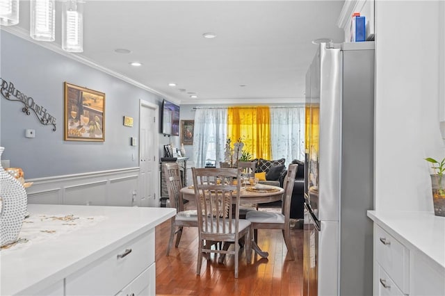43 Amsterdam St, Providence, RI 02909 - dining space featuring ornamental molding, hardwood / wood-style flooring, wainscoting, a decorative wall, and recessed lighting