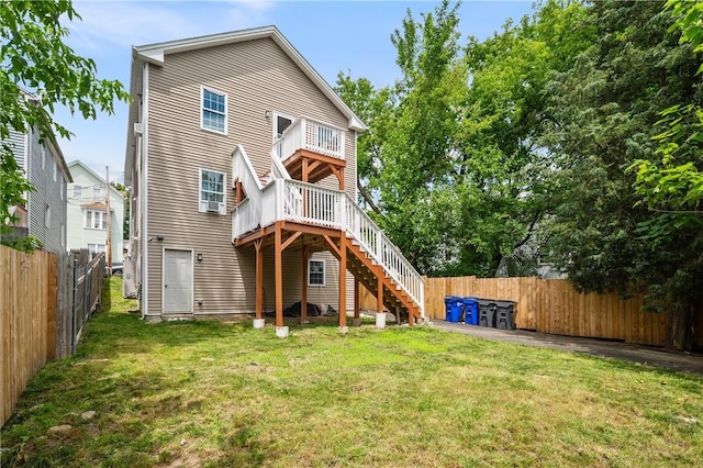 43 Amsterdam St, Providence, RI 02909 - back of property with a fenced backyard, stairs, and a wooden deck