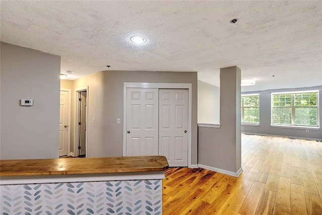 2 School St Unit 334, Lincoln, RI 02802 - kitchen featuring a textured ceiling, light wood-style floors, butcher block counters, and open floor plan
