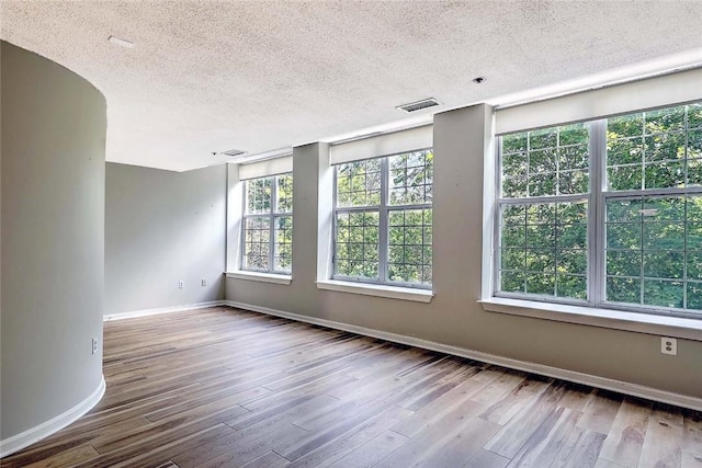 2 School St Unit 334, Lincoln, RI 02802 - unfurnished room with a textured ceiling and wood finished floors