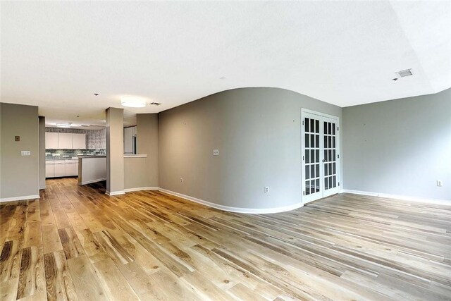 2 School St Unit 334, Lincoln, RI 02802 - unfurnished living room featuring light wood finished floors and baseboards