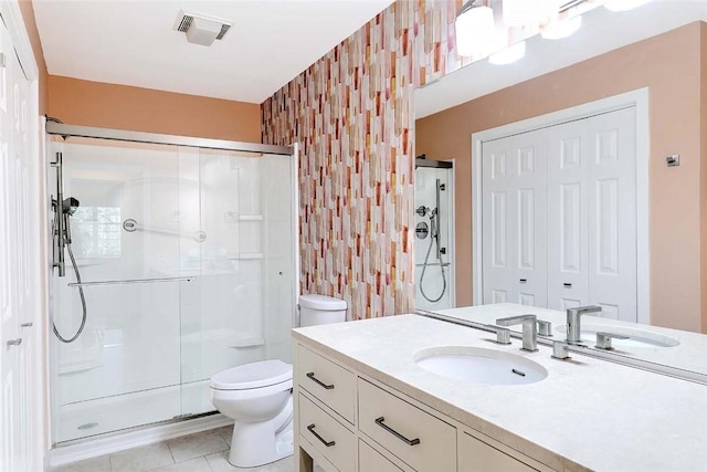 2 School St Unit 334, Lincoln, RI 02802 - bathroom with a stall shower, vanity, wallpapered walls, and tile patterned flooring