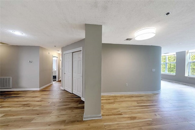 2 School St Unit 334, Lincoln, RI 02802 - unfurnished room featuring a textured ceiling and light wood-style flooring
