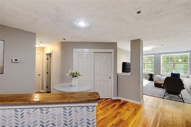 2 School St Unit 334, Lincoln, RI 02802 - kitchen with a textured ceiling, light wood finished floors, open floor plan, and recessed lighting