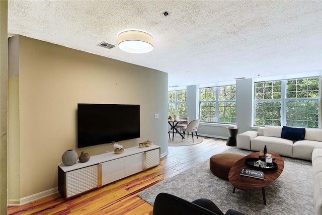2 School St Unit 334, Lincoln, RI 02802 - living room with a textured ceiling and wood finished floors