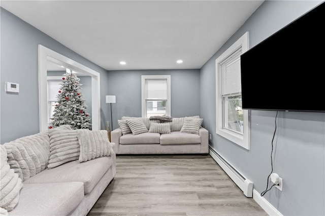 31 Stadden St, Providence, RI 02907 - living room featuring a baseboard radiator, light wood-type flooring, and recessed lighting