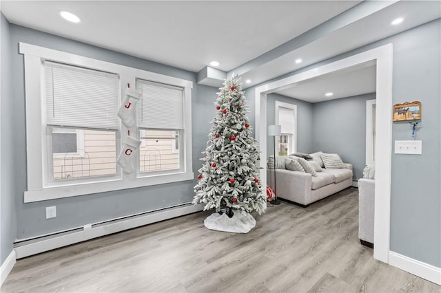 31 Stadden St, Providence, RI 02907 - living area featuring baseboard heating, recessed lighting, and wood finished floors