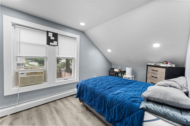 31 Stadden St, Providence, RI 02907 - bedroom featuring a baseboard radiator, lofted ceiling, wood finished floors, cooling unit, and recessed lighting