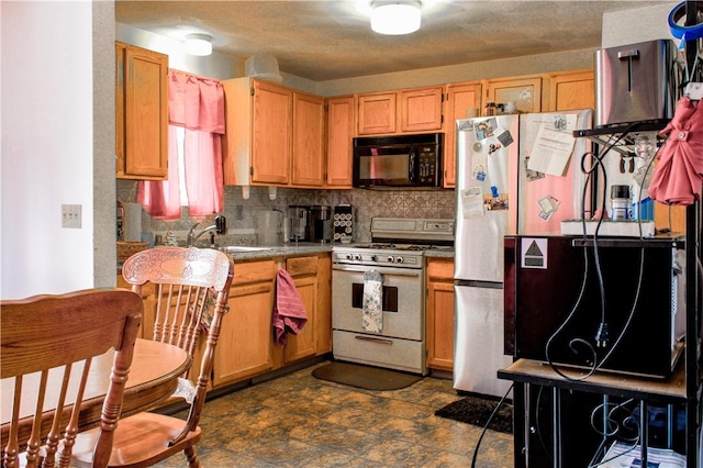 14 Drawbridge Dr, West Warwick, RI 02893 - kitchen featuring black microwave, gas range gas stove, backsplash, and freestanding refrigerator