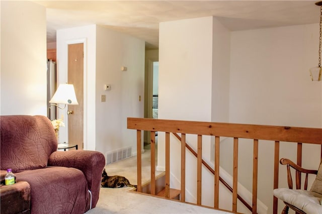 14 Drawbridge Dr, West Warwick, RI 02893 - sitting room with carpet floors and an upstairs landing