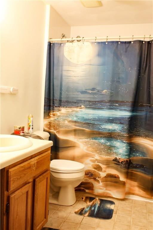 14 Drawbridge Dr, West Warwick, RI 02893 - bathroom featuring tile patterned floors, vanity, and curtained shower