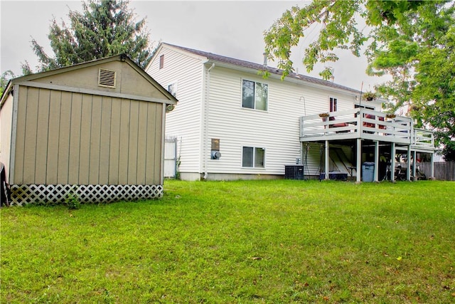 14 Drawbridge Dr, West Warwick, RI 02893 - back of house with a lawn, a wooden deck, and a storage unit