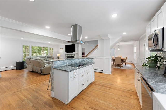 15 Bestwick Trl, Coventry, RI 02816 - kitchen featuring stainless steel appliances, ornamental molding, open floor plan, a fireplace, and a breakfast bar area