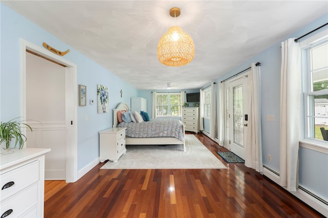 15 Bestwick Trl, Coventry, RI 02816 - bedroom featuring wood finished floors, access to exterior, and baseboard heating