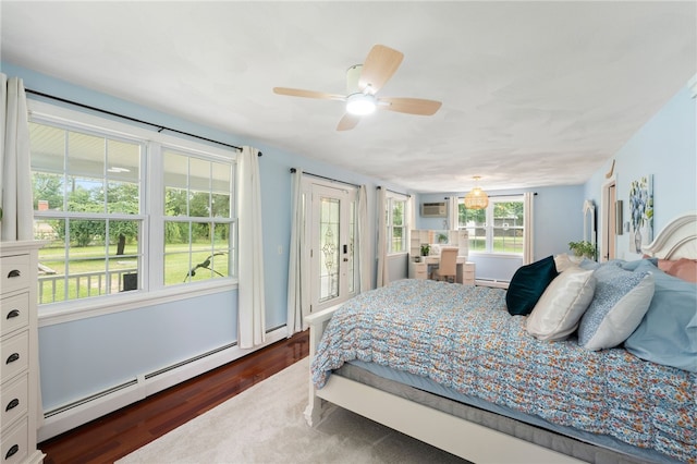 15 Bestwick Trl, Coventry, RI 02816 - bedroom with a baseboard radiator, dark wood-type flooring, access to outside, ceiling fan, and baseboard heating