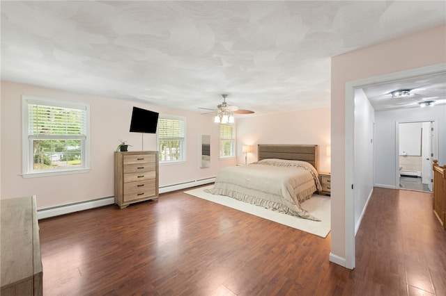 15 Bestwick Trl, Coventry, RI 02816 - bedroom featuring a baseboard heating unit, a baseboard radiator, dark wood-type flooring, and a ceiling fan