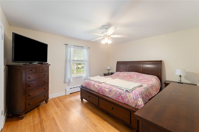 15 Bestwick Trl, Coventry, RI 02816 - bedroom featuring a baseboard radiator, light wood finished floors, and a ceiling fan