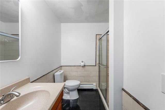 15 Bestwick Trl, Coventry, RI 02816 - bathroom featuring baseboard heating, tile walls, vanity, an enclosed shower, and a wainscoted wall