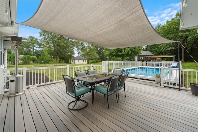 15 Bestwick Trl, Coventry, RI 02816 - wooden terrace featuring outdoor dining space, an outdoor structure, and a lawn