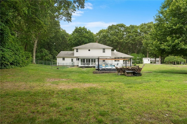 15 Bestwick Trl, Coventry, RI 02816 - back of house with a sunroom and a forest view