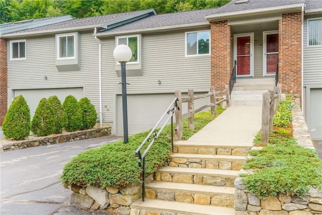 125 Smith Ave Unit 4C, Smithfield, RI 02828 - view of front of house with a garage and roof with shingles