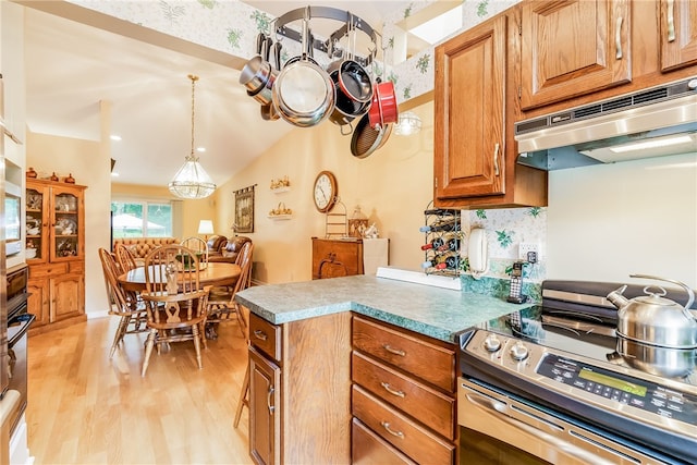 125 Smith Ave Unit 4C, Smithfield, RI 02828 - kitchen featuring stainless steel electric range, under cabinet range hood, light wood-style flooring, brown cabinetry, and a peninsula