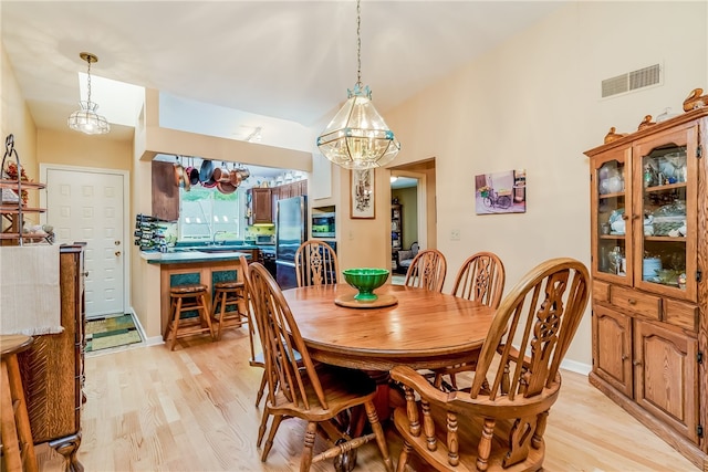 125 Smith Ave Unit 4C, Smithfield, RI 02828 - dining room with a chandelier and light wood finished floors