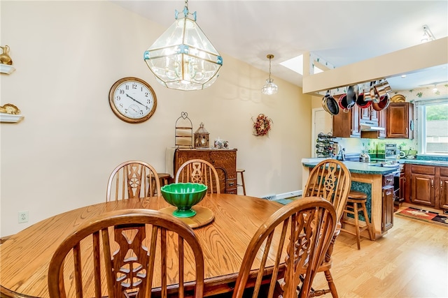 125 Smith Ave Unit 4C, Smithfield, RI 02828 - dining space featuring light wood finished floors and a chandelier