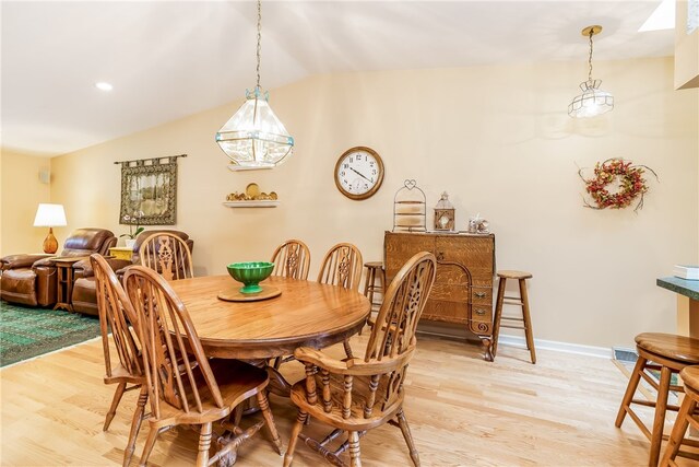 125 Smith Ave Unit 4C, Smithfield, RI 02828 - dining space with light wood-style flooring and lofted ceiling