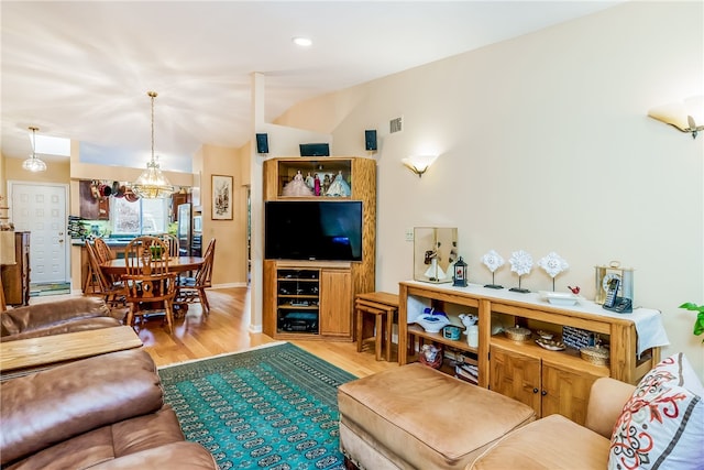 125 Smith Ave Unit 4C, Smithfield, RI 02828 - living room featuring wood finished floors, vaulted ceiling, and a chandelier