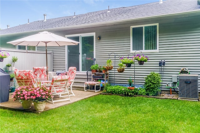 125 Smith Ave Unit 4C, Smithfield, RI 02828 - rear view of house with a shingled roof and a patio
