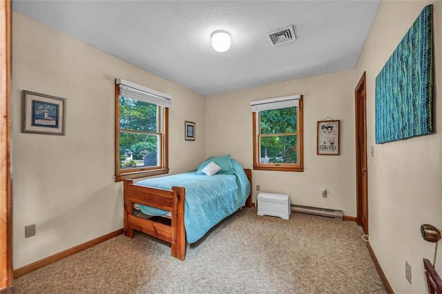 146 Balsam Rd, South Kingstown, RI 02879 - bedroom with a baseboard heating unit and carpet floors
