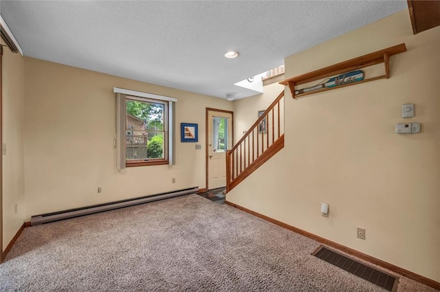 146 Balsam Rd, South Kingstown, RI 02879 - carpeted entrance foyer with a baseboard heating unit, stairs, a skylight, recessed lighting, and a textured ceiling