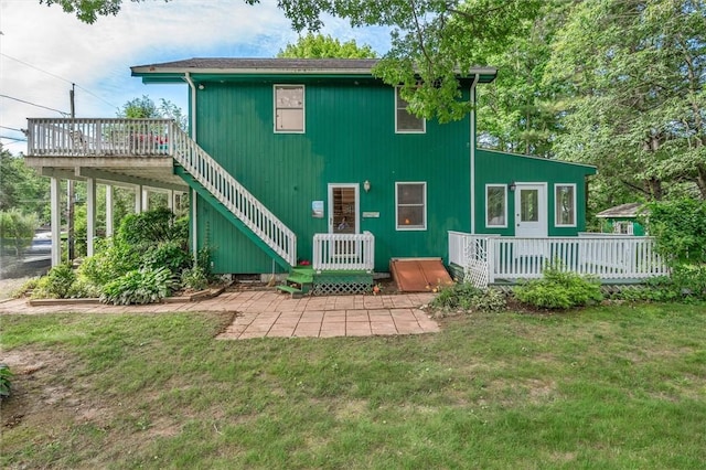 146 Balsam Rd, South Kingstown, RI 02879 - back of house with a wooden deck, a lawn, and a patio