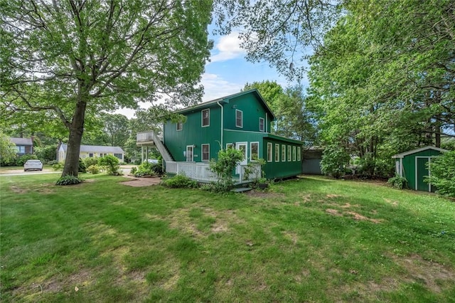 146 Balsam Rd, South Kingstown, RI 02879 - back of house with a storage shed, a yard, and a deck