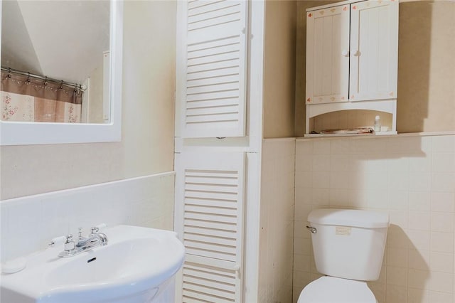 36 Gardner Ave, West Warwick, RI 02893 - bathroom featuring tile walls and wainscoting