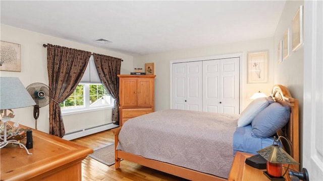 24 Mello St, West Warwick, RI 02893 - bedroom featuring a baseboard heating unit, light wood finished floors, and a closet
