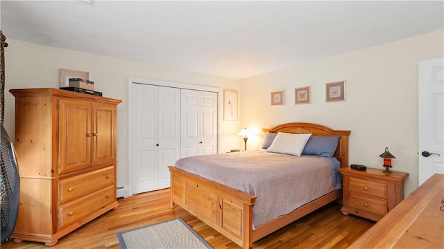 24 Mello St, West Warwick, RI 02893 - bedroom featuring light wood finished floors, a closet, and baseboard heating