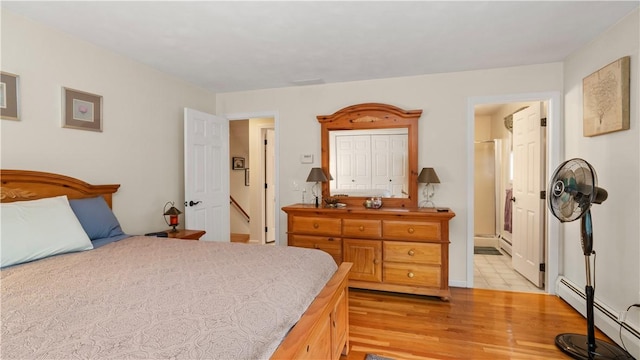24 Mello St, West Warwick, RI 02893 - bedroom with baseboard heating, light wood finished floors, and a baseboard heating unit