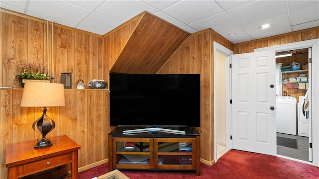 24 Mello St, West Warwick, RI 02893 - carpeted living area featuring washer and dryer and wood walls