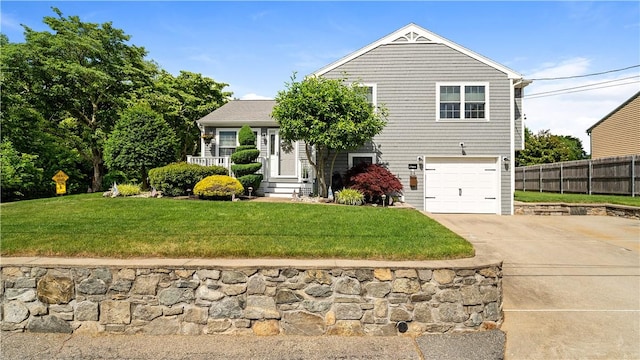 24 Mello St, West Warwick, RI 02893 - view of front of home featuring concrete driveway and a garage