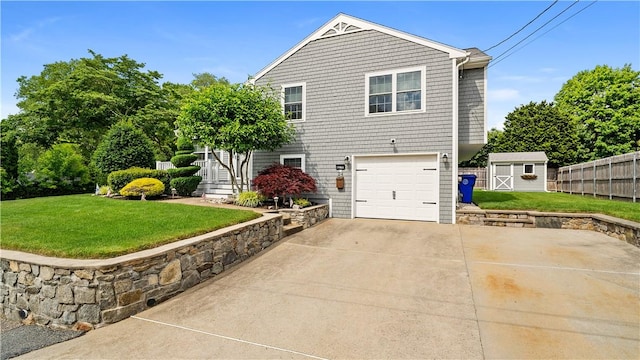 24 Mello St, West Warwick, RI 02893 - view of side of property with driveway, a garage, and a storage unit