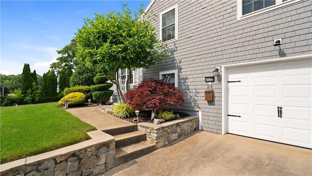 24 Mello St, West Warwick, RI 02893 - view of property exterior with a garage, a yard, and driveway