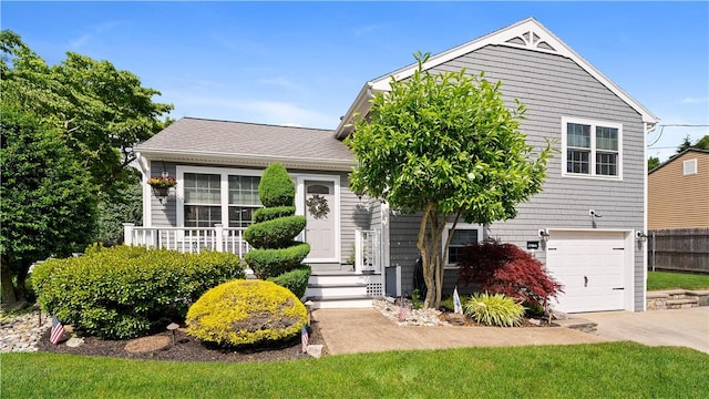 24 Mello St, West Warwick, RI 02893 - view of front of house with a garage and driveway