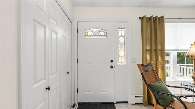 24 Mello St, West Warwick, RI 02893 - entrance foyer featuring a baseboard radiator and light tile patterned floors